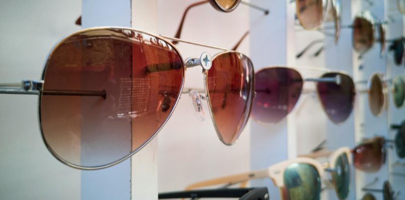 A row of sunglasses on display at the opticians